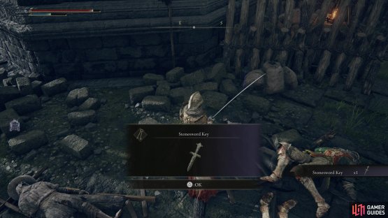 Loot a corpse south of the ballista to obtain a Stonesword Key.