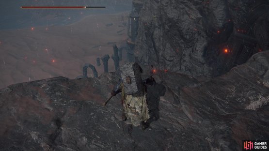and search for the cliff facing some distinct ruins on the beach below.