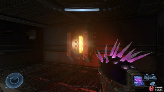 Shoot the power core above the door to remove the energy barrier