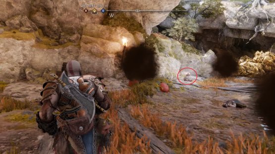 You need to throw a fire bomb at the chest to destroy the rubble and access it.