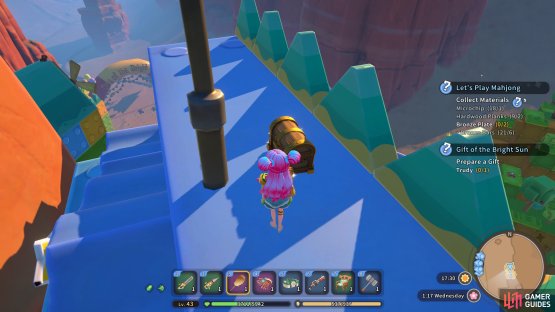 The next chest is located on top of the toy clock tower.