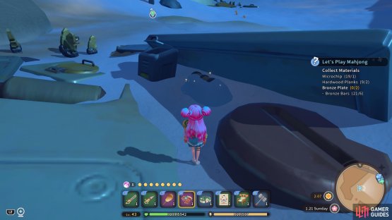 The chest is nestled in between some debris covered by sand.