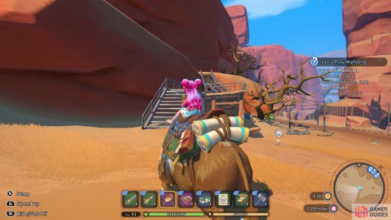 The chest is located up the stairs next to a tree.