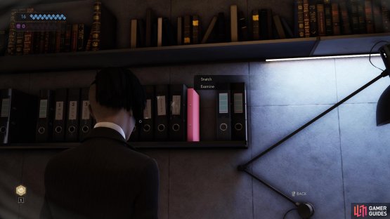 Snatch the pink file on the shelves to the left of Jara Drory&rsquo;s computer