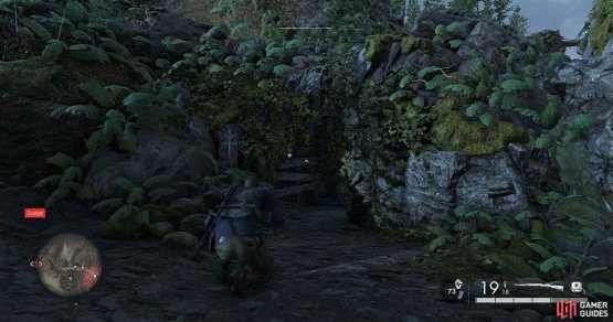 Hiding behind a barricade in the hills side. You need to dismantle it.