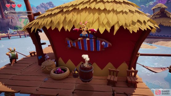 Use the barrel here to get onto the roof of the fisherman&rsquo;s hut