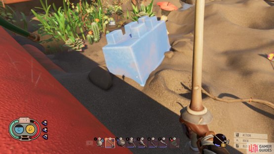 Look out for the blue sandcastle bucket and then locate the anthill hole