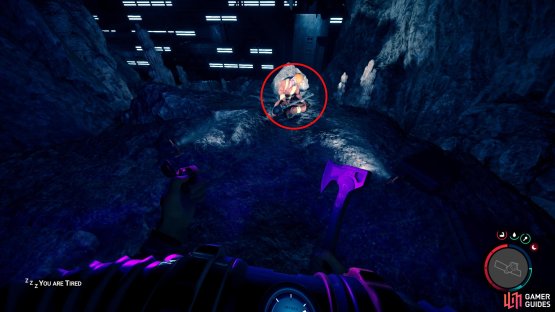 The shovel will be lying in the hands of the dead man slumped against the rock.