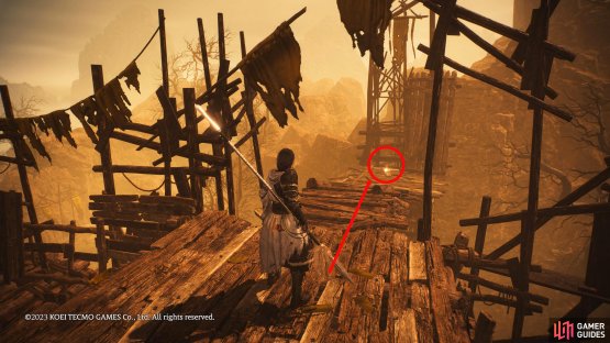 At the top, you&rsquo;ll find a wooden platform leading away from the scaffold with a shiny item at the end of it. This is the Shell.