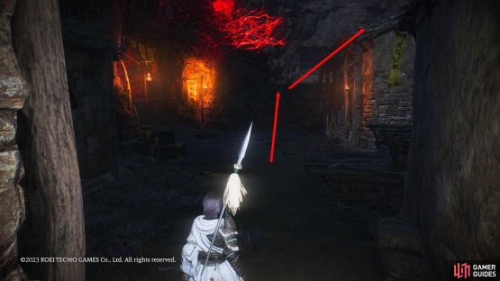 Just before you enter the cave area, climb onto the roof then jump on the second roof with the yellow flag.