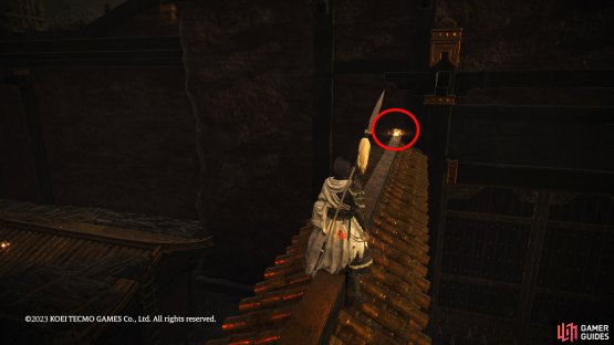 Jump onto the thin wall and follow it to your left to find the shell.