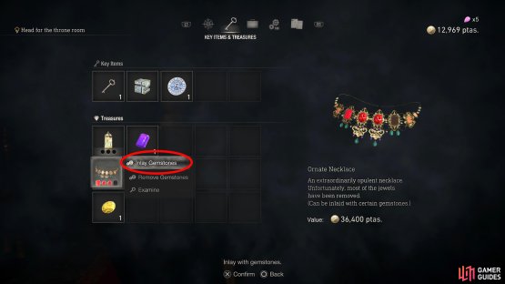 Head to the Key Items and Treasures tab on the main menu and select &ldquo;Inlay Gemstone&rdquo;.