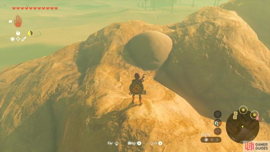 Blow away the sand pile here for another orb