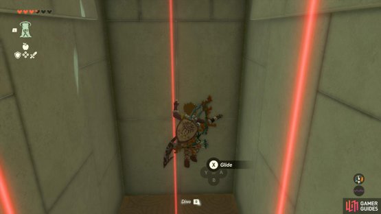 Walk into the lasers to drop down below