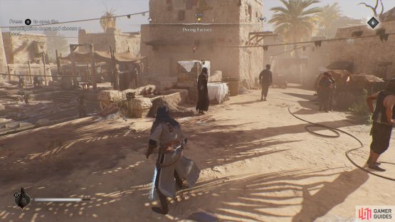 Head to the area around the dyeing factory, the artifact is held by a worker.
