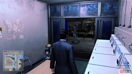 Look inside the laundromat to find him in the corner.