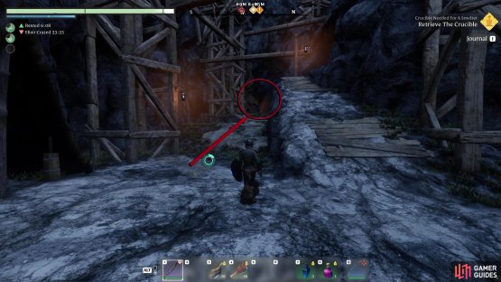 Run through the camp and go through the tunnel on the first floor, at the back of the mine.