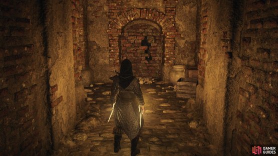After taking ownership of this tomb, smash a flimsy brick wall to the east,