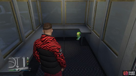 to find the action figure sitting inside a booth.