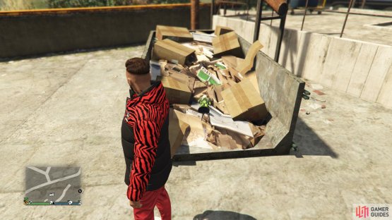 to find this action figure sitting on a pile of trash