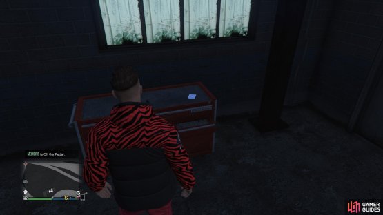 to find the Playing Card sitting on a toolbox.