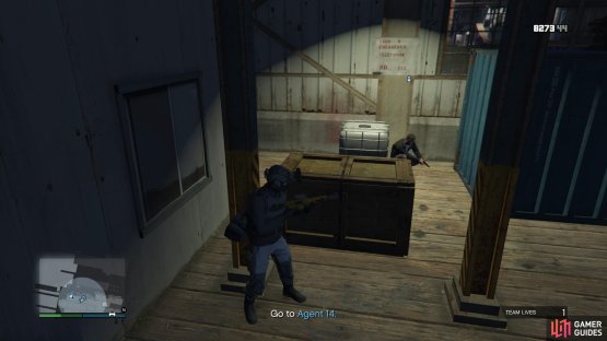 Approach Agent 14 who&rsquo;s hiding behind a crate