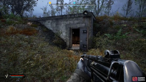 You&rsquo;ll find a small bunker with its door open. Head inside.