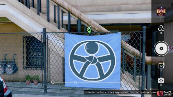 Look for this blue banner hanging on the fence and snap a photo of it.
