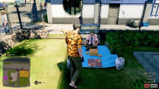 The NPC will be sitting on the ground just behind the shrine where you hand in Fortune Slips.