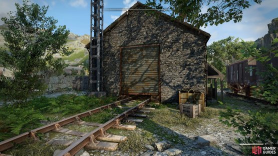 Enter the railyard building south of the road,