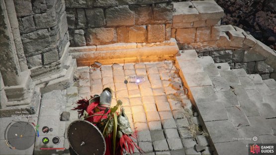 Read the inscription on the tower&rsquo;s entrance, then pick up a Small Pebble,
