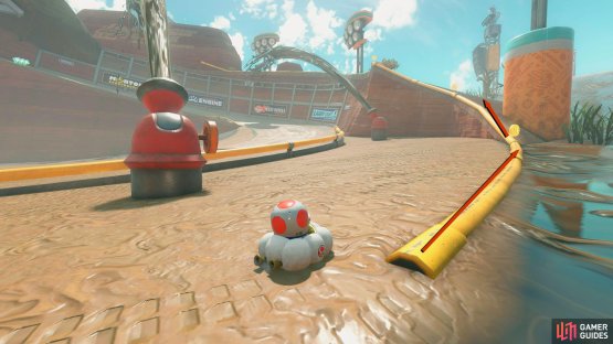 Ride the yellow rail around the corner and then get off it when you reach the slope.