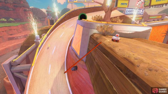 From the last panel, drop off the cliff back onto the track.