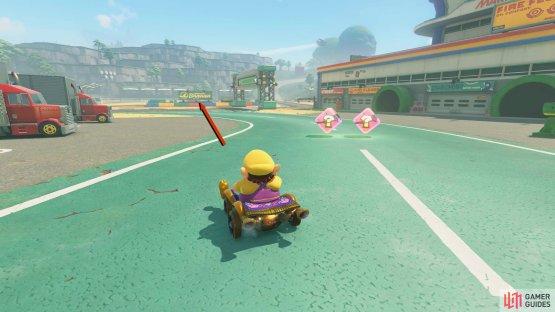 Go to the area with the Nabbit Trucks, but continue past them. Charge a jump and release it when you reach the banana sign.