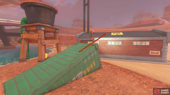 Get some speed, charge your jump, and release it at the top of the container to reach the panel.