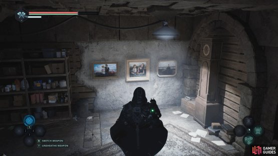 Place the family photos on the wall near the locked door as shown in the image.