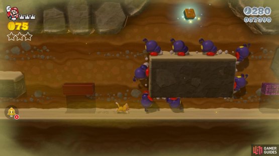 The Stamp will be located in the little cave, by the ledge with all of the Ant Troopers