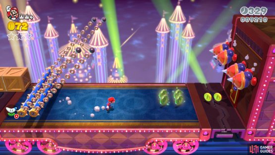 You have to dodge the spiked roller to get the coins and the second Green Star