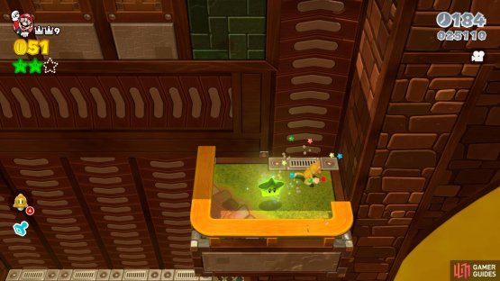The third Green Star is on a ledge by the mass of conveyors