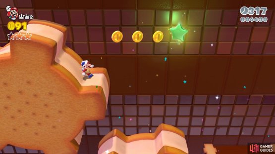 The first Green Star is in the air above the first set of large cogs