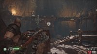 Keep the wheel held and use the axe to lock the bridge in place.