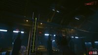 In the middle of the room is a ladder. Climb it and follow the walkway to the end.