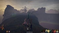 From the stone bridge, you will be able to see the ruins where the Flooded Cellar is located.