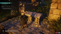 Take the key from beneath the tombstone being searched by the guards.