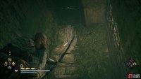 Shoot the wooden barricade to access the chest from above.