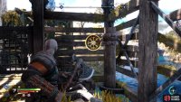 Hit the spinning wheel to lower the gate.