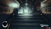 Head to the end of the corridor and go through the right door.