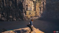 Drop down onto the platform and grapple across,