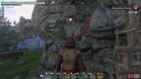 Turn south and use the barrel grapple point to cross the gap, and then climb up the frames.