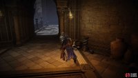Head through the doorway, across the bridge, and open the doors.